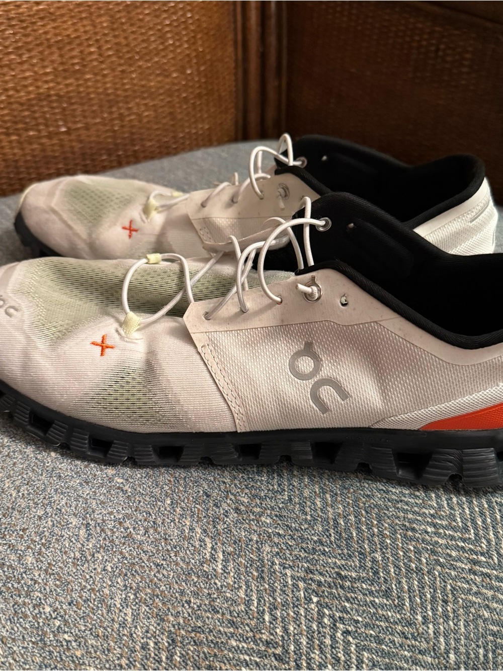 On Running Men’s White and Black Athletic Shoes with Orange Accent